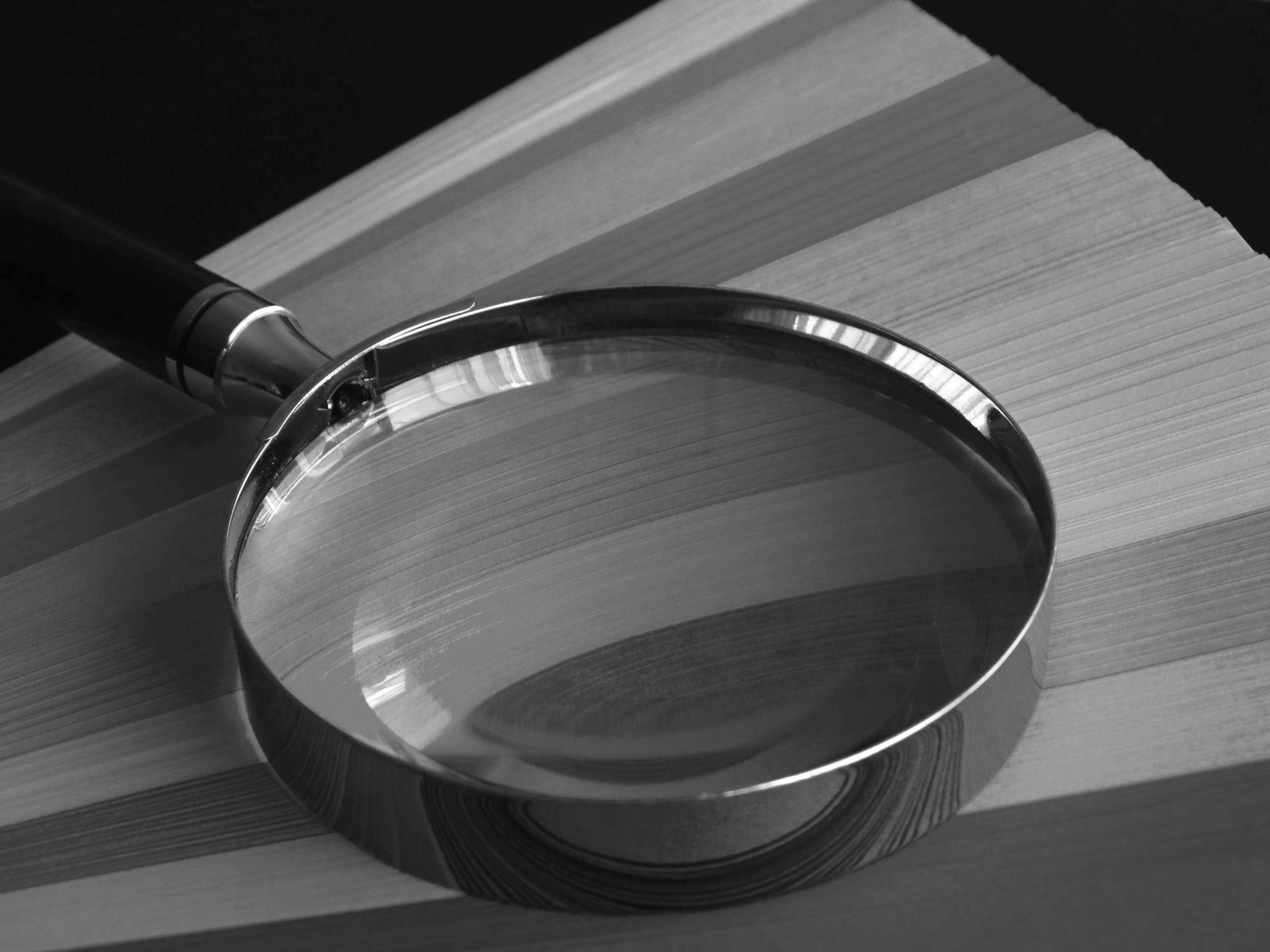 Magnifying glass representing inspection and quality control